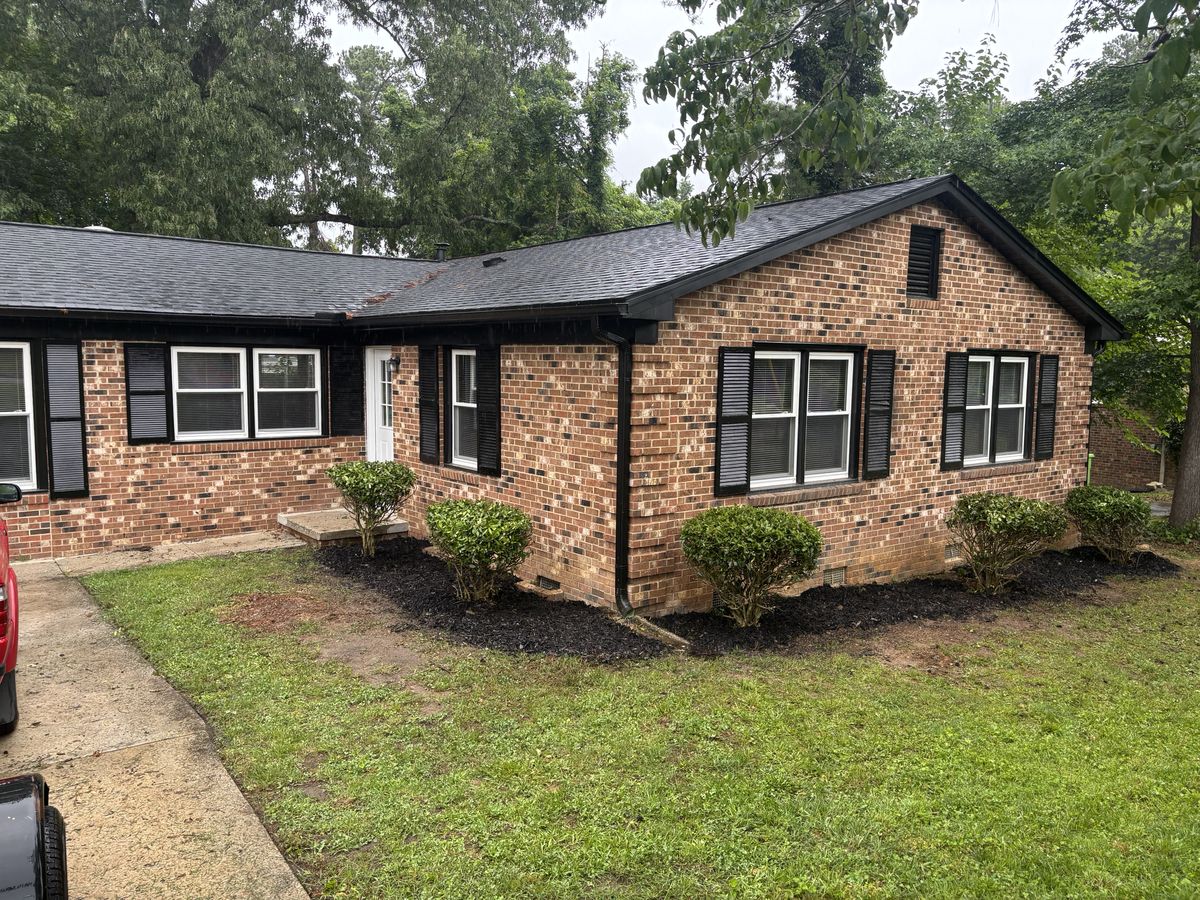 The finished house: full shrubs and fresh mulch along the entire front bed